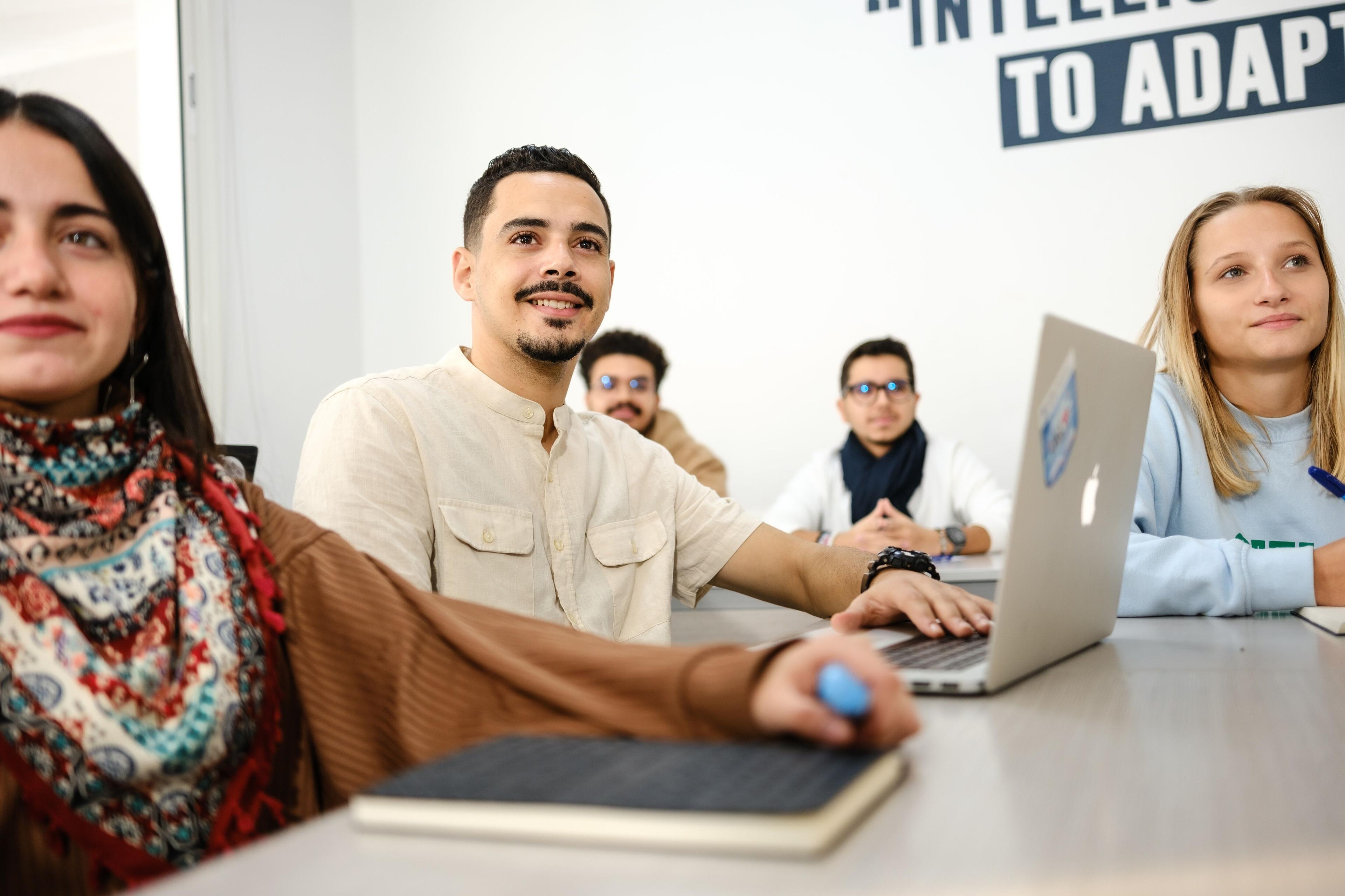 Engaged employees participating in a corporate workshop, displaying a dynamic and collaborative learning environment.